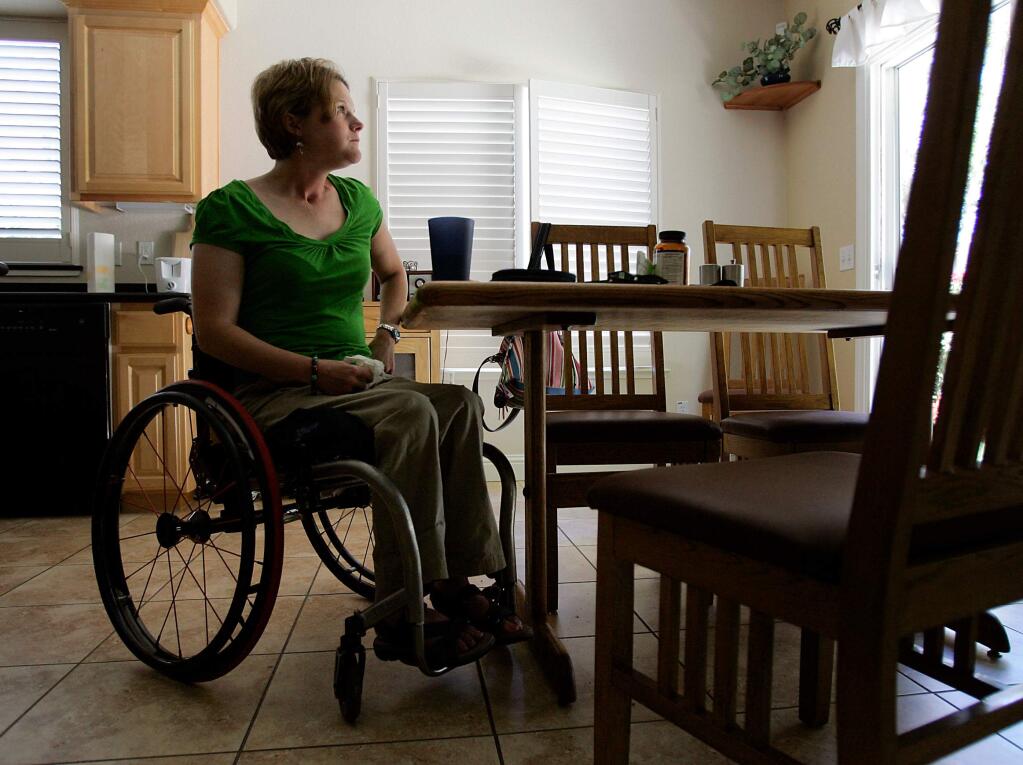 Jill Mason has lunch at her Sacramento home on Thursday, July 30, 2009. Mason, a paraplegic, was severely injured by drunk driver Harvey Hereford while bicycling along Highway 12, near Oakmont, in April 2004. Alan Liu, her boyfriend, was killed in the accident.
