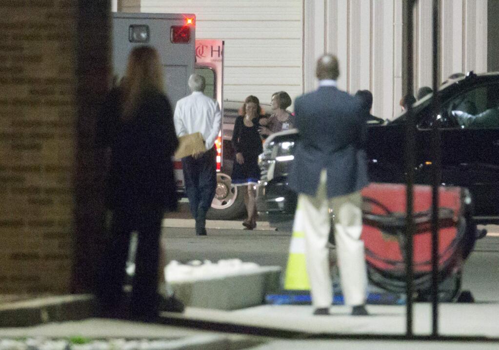 Family members return to their vehicles after Otto Warmbier, a 22-year-old University of Virginia undergraduate, who was detained and imprisoned in North Korea, is loaded into an ambulance at Lunken Airport in Cincinnati, Tuesday, June 13, 2017. Warmbier whose parents say he has been in a coma while serving a 15-year prison term in North Korea was released and returned to the United States Tuesday, as the Trump administration revealed a rare exchange with the reclusive country. (Sam Greene/The Cincinnati Enquirer via AP)