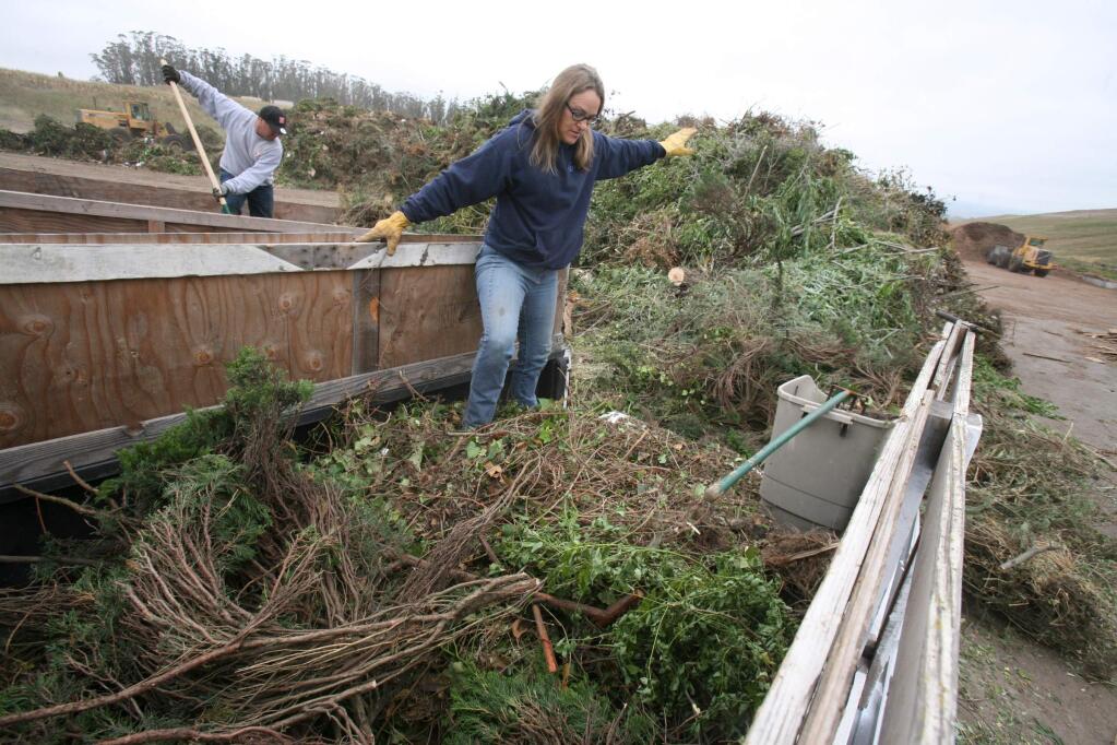 Jodie Gallagher of Petaluma unloads a truck load of yard materials to be turned in to compost at Sonoma Compost on Monday, May 18, 2015. (SCOTT MANCHESTER/ARGUS-COURIER STAFF)