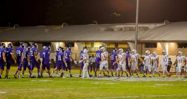 Petaluma's and Vintage's players shake hands after their football game at Petaluma High School on Friday, September 4, 2015. (JOHN O'HARA /FOR THE ARGUS-COURIER)