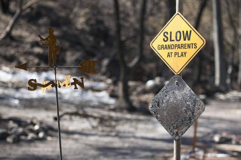 A scorched sign and homes remain on Thursday Sept. 17, 2015 in Anderson Springs, Calif. The Valley Fire that sped through Middletown and other parts of rural Lake County has continued to burn since Saturday despite a massive firefighting effort. (Paul Kitagaki Jr./The Sacramento Bee via AP)