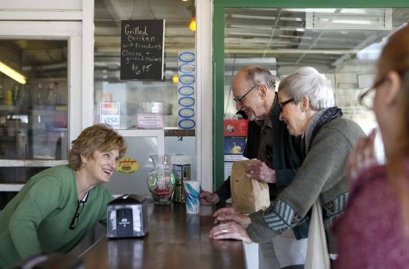 Owner Claudia Clow, left, reaches for a straw as she waits on customers Mel and Dorothy Witt at Pick's Drive-In in Cloverdale, California on Monday, March 28, 2011. (BETH SCHLANKER/ The Press Democrat)