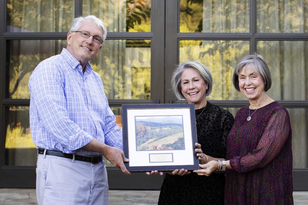 Laurie Anderson, right, and Lynn Finch, middle, accept Land Trust of Napa County‚Äôs 2019 Acre by Acre Award on behalf of their family from CEO Doug Parker during the non-profit‚Äôs yearly Cornerstone Society Gathering on September 28, 2019.(Megan Reeves Photography)