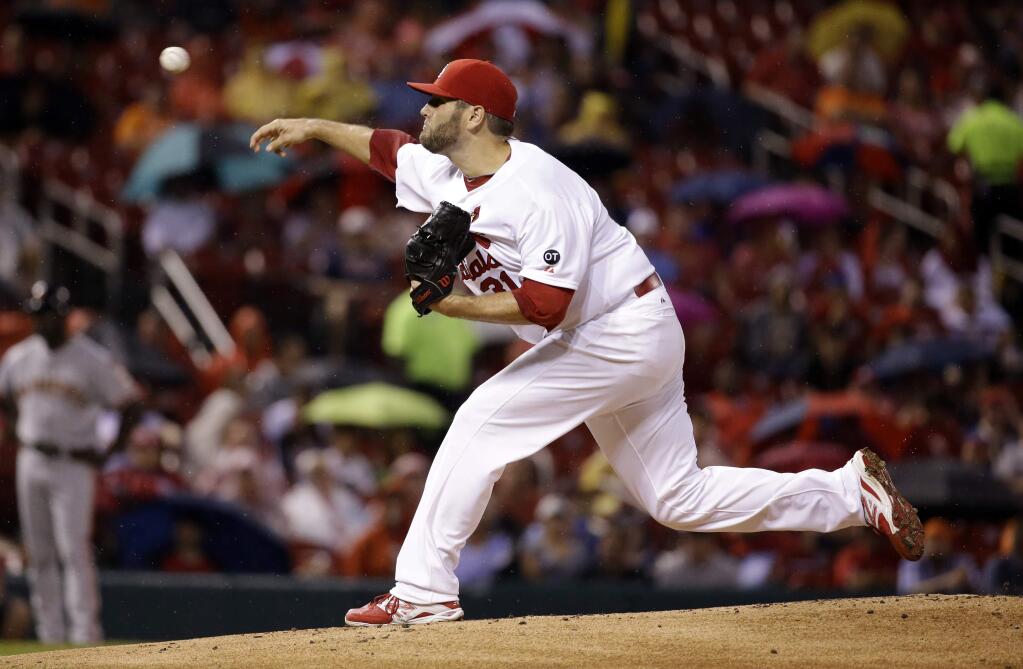 St. Louis Cardinals starting pitcher Lance Lynn throws during the first inning of a baseball game against the San Francisco Giants, Tuesday, Aug. 18, 2015, in St. Louis. (AP Photo/Jeff Roberson)