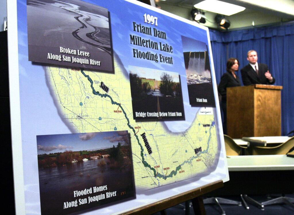 Photographs of flooding along the San Joaquin River in 1997 on display at a state Capitol news conference on water storage. (RICH PEDRONCELLI / Associated Press, 2006)