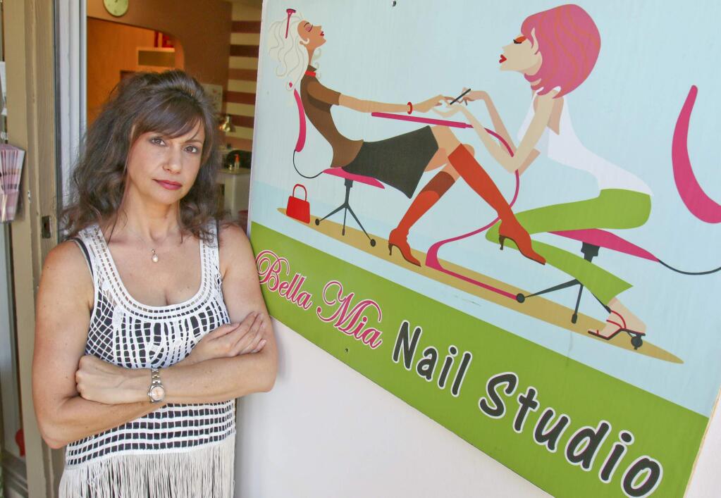 Jolene Peterson in front of her Bella Mia Nail Studio on Petaluma blvd. N. in Petaluma on Tuesday, June 23, 2015. Peterson says that Bella Femme Nail Spa has taken her name and customers away due to the closeness of their names. (SCOTT MANCHESTER/ARGUS-COURIER STAFF)