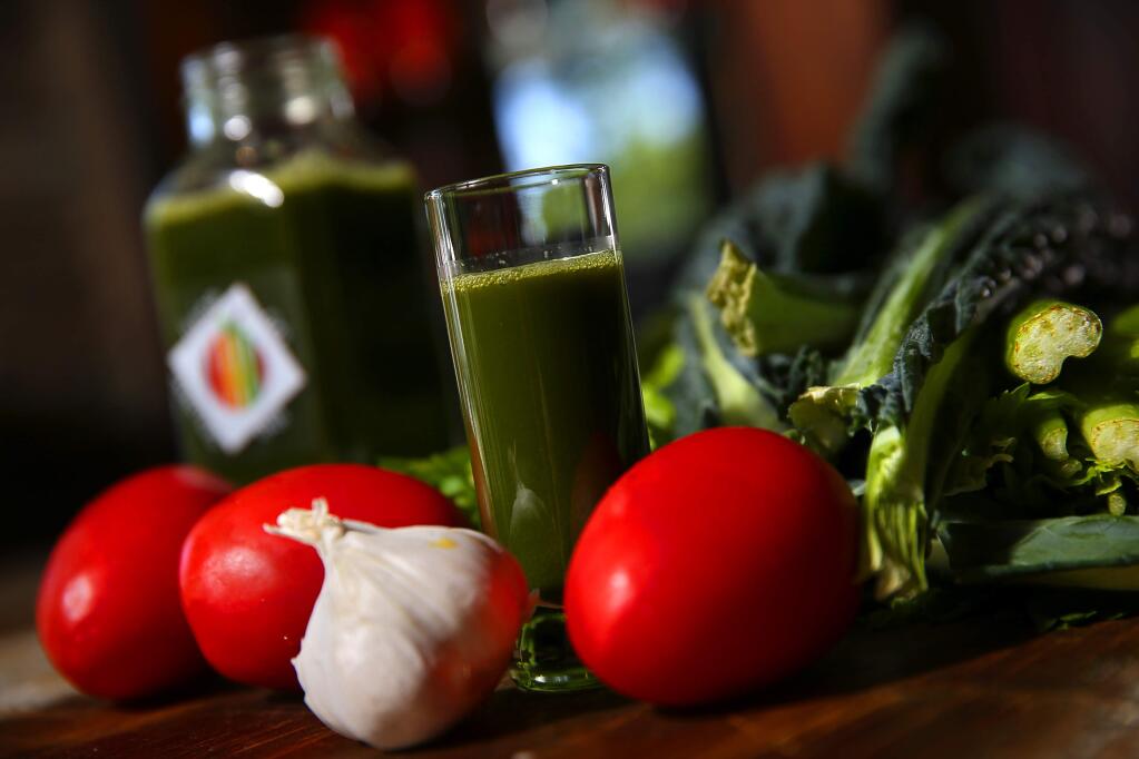 Virgin Mary juice, made with celery, tomatoes, kale, garlic, parsley and lemon, by Wes Coffman of Juice on the Square.(Christopher Chung/ The Press Democrat)