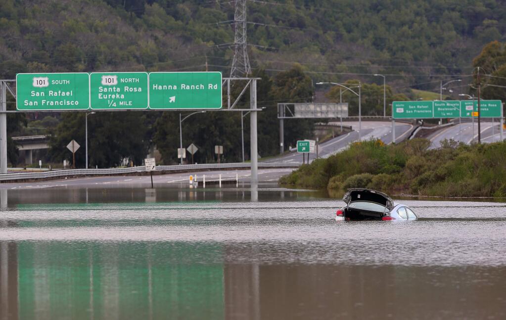 Flood waters forced the closure of all lanes in both directions of Highway 37, east of the Hannah Ranch Road offramp, in Novato, on Monday, January 23, 2017. (CHRISTOPHER CHUNG/THE PRESS DEMOCRAT)