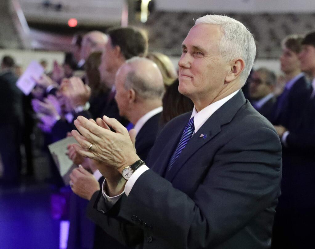Vice President-elect Mike Pence applauds during the inaugural ceremony for Indiana's statewide office holders, Monday, Jan. 9, 2017, in Indianapolis. (AP Photo/Darron Cummings, Pool)