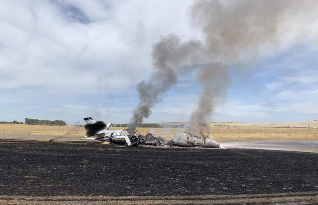 FILE - This Aug. 21, 2019, file photo, provided by the California Highway Patrol shows the scene where a jet burst into flames after aborting a takeoff in Oroville, Calif. Investigators say the pilot of a charter jet that skidded off a Northern California runway last month reported that he couldn't get the plane off the ground despite repeated attempts. The National Transportation Safety Board said in its preliminary accident report Thursday, Sept. 5, 2019, that the Delta Private Jets pilot felt 'just a weird sensation' as he pulled the yoke back and the airplane didn't lift off.(California Highway Patrol via AP, File)