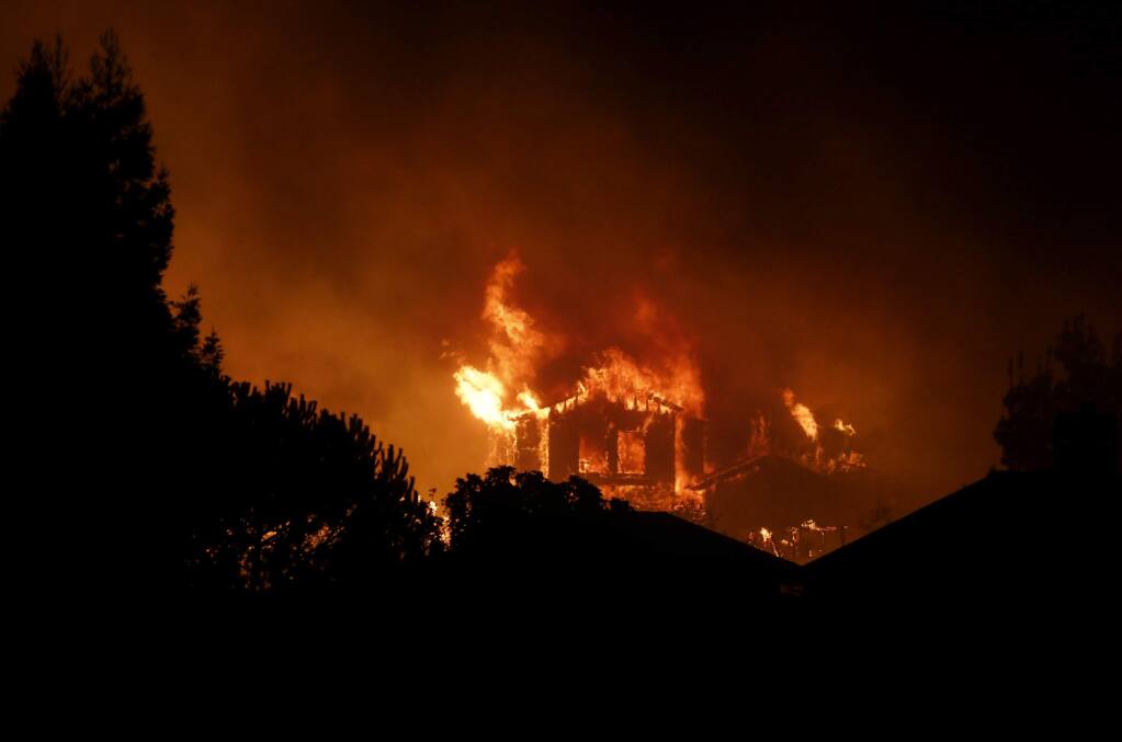 A home burns in the Fountaingrove area on Monday, October 9, 2017 in Santa Rosa, California . (BETH SCHLANKER/The Press Democrat)