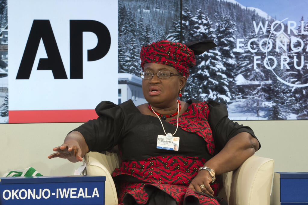 FILE - In this Friday, Jan. 24, 2014 file photo, Nigerian Finance Minister Ngozi Okonjo-Iweala during a panel discussion "The Post-2015 Goals: Inspiring a New Generation to Act", the fifth annual Associated Press debate, at the World Economic Forum in Davos, Switzerland. Okonjo-Iweala was appointed Monday, Feb. 15, 2021 to head the World Trade Organization as it seeks to to resolve disagreements over how it decides cases involving billions in sales and thousands of jobs. Okonjo-Iweala was appointed as director-general of the leading international trade body by representatives of the 164 member countries, according to a statement from the body. (AP Photo/Michel Euler, file)