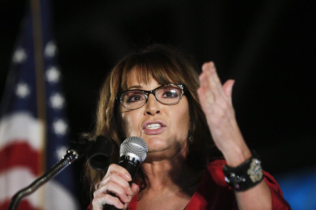 FILE - In this Sept. 21, 2017, file photo, former vice presidential candidate Sarah Palin speaks at a rally in Montgomery, Ala. (AP Photo/Brynn Anderson, File)