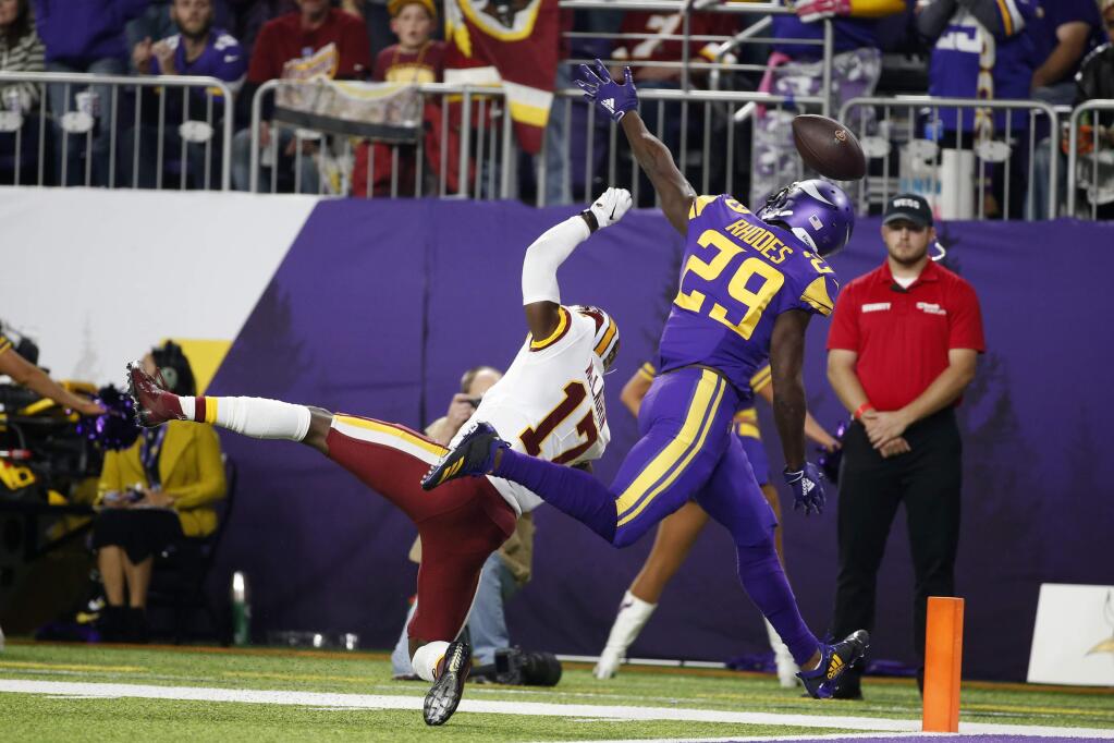 In this Oct. 24, 2019, file photo, Minnesota Vikings cornerback Xavier Rhodes (29) breaks up a pass intended for Washington Redskins wide receiver Terry McLaurin (17) during the first half in Minneapolis. (AP Photo/Bruce Kluckhohn, File)