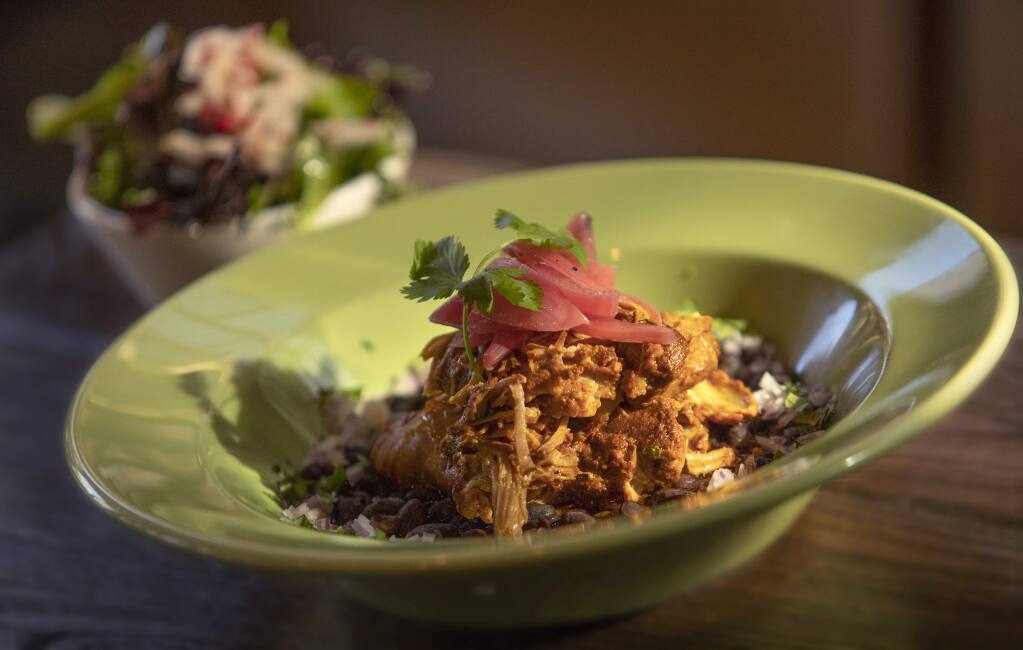 Cochinita Pibil with braised pork, salsa habanero, chars beans, red onions and cilantro from Cascabel Mexican Bar & Grill in Santa Rosa. (photo by John Burgess/The Press Democrat)