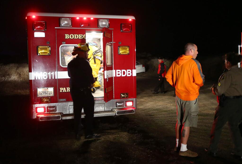 Emergency personnel prepare to transport a 4-year-old boy into an ambulance after he was rescued from falling off a cliff on Bodega Head, in Bodega Bay on Monday, Nov. 10, 2014. (CHRISTOPHER CHUNG/ PD)