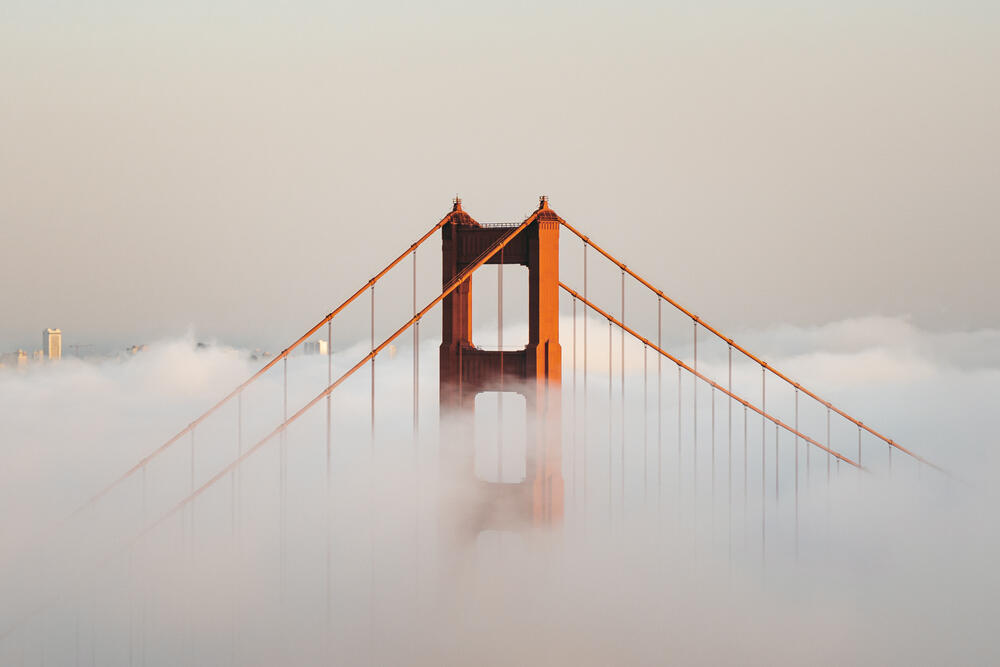 The Golden Gate Bridge engulfed in evening fog. (Christer Dabu/Shutterstock)