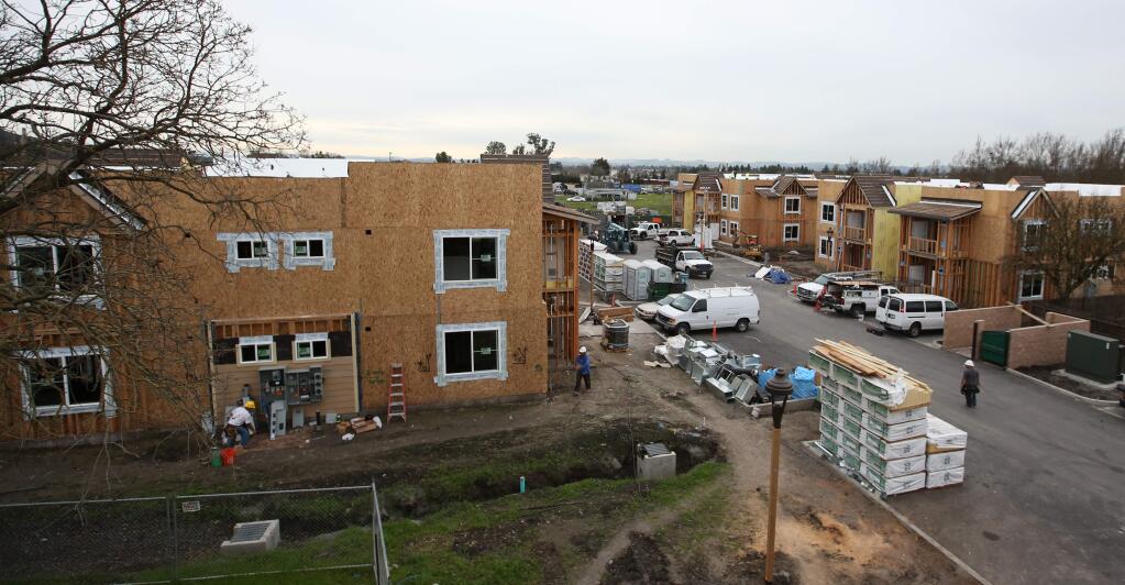 A 42-unit affordable housing project called Tierra Springs is going up at Kawana Springs Road and Petaluma Hill Road, Tuesday, January 27, 2015. (Crista Jeremiason / The Press Democrat)