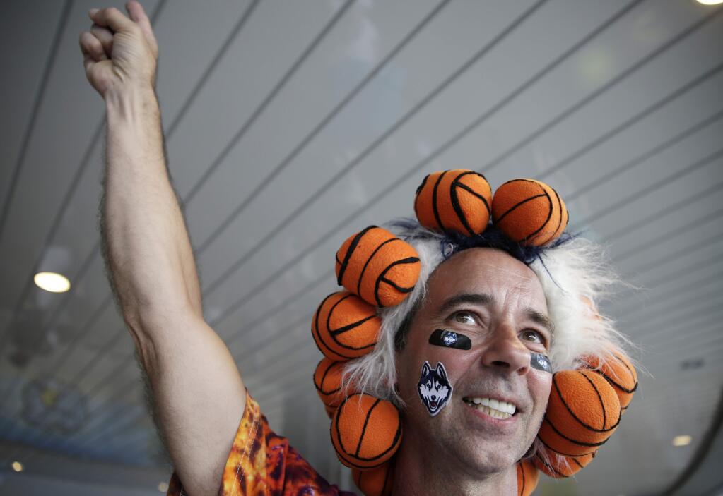 Danny Karwoski, of Stamford, Conn., walks into the stadium before the first half of the NCAA women's Final Four tournament college basketball championship game between Connecticut and Notre Dame, Tuesday, April 7, 2015, in Tampa, Fla. (AP Photo/Brynn Anderson)