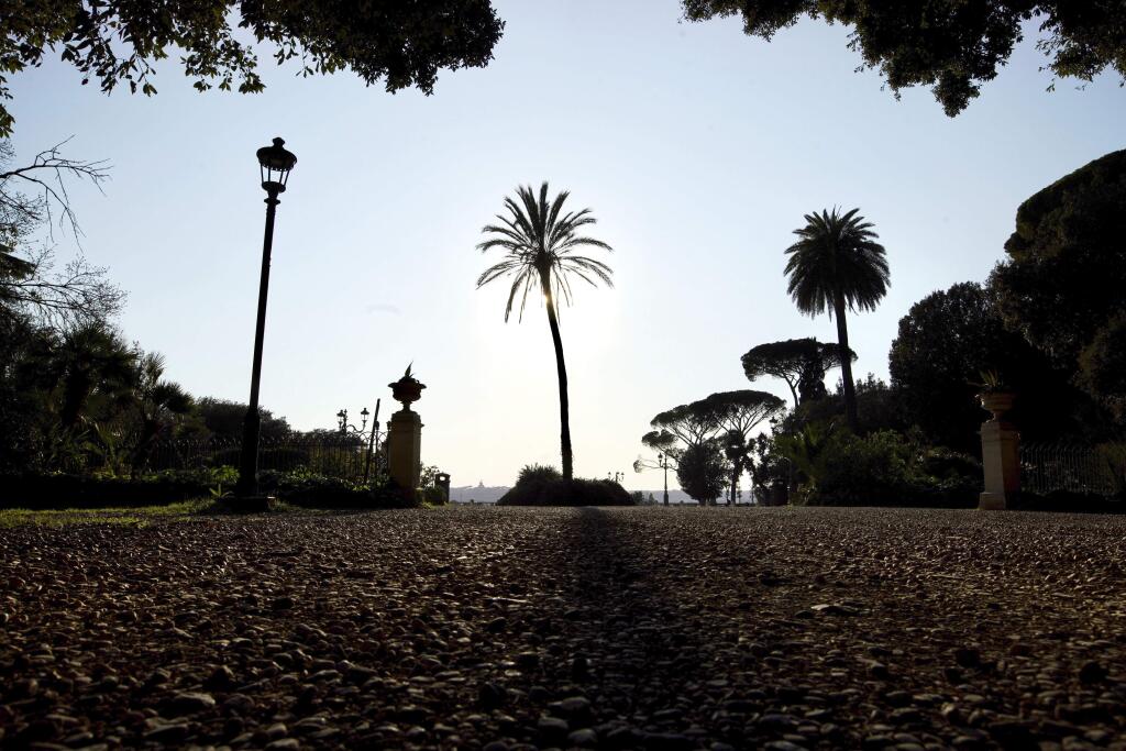 A view of deserted Pincio park in downtown Rome, Thursday, March 19, 2020. Italian officials are warning they might impose tougher restrictions on mobility, including on even outdoor sports which have already been restricted to individual outings, such as jogging. For most people, the new coronavirus causes only mild or moderate symptoms. For some it can cause more severe illness. (AP Photo/Andrew Medichini)