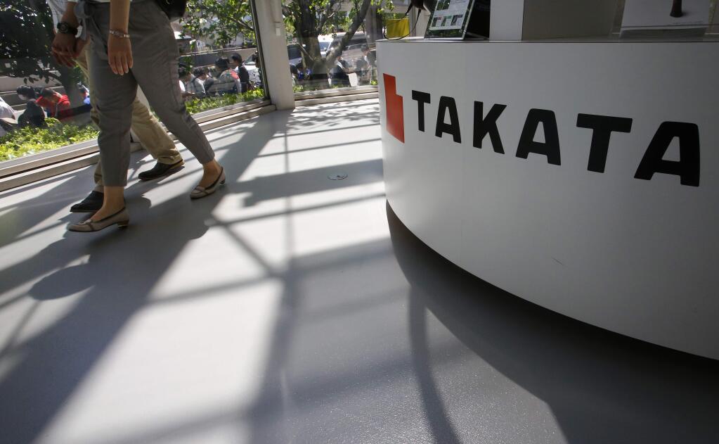 FILE - In this May 4, 2016, file photo, visitors walk by a Takata Corp. desk at an automaker's showroom in Tokyo. The National Highway Traffic Safety Administration said Thursday, June 30, 2016, it is urging owners of 313,000 older Hondas and Acuras to stop driving them and get them repaired after new tests found that their Takata air bag inflators are extremely dangerous. The agency's urgent advisory covers 2001 and 2002 Honda Civics and Accords, the 2002 and 2003 Acura TL, the 2002 Honda Odyssey and CR-V, and the 2003 Acura CL and Honda Pilot, NHTSA said. 'These vehicles are unsafe and need to be repaired immediately,' Transportation Secretary Anthony Foxx said in a statement. 'Folks should not drive these vehicles unless they are going straight to a dealer to have them repaired.' (AP Photo/Shizuo Kambayashi, File)