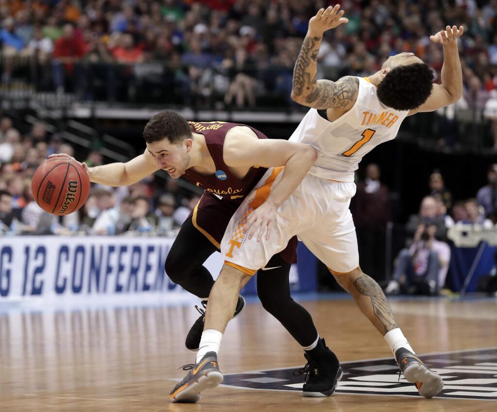 Loyola-Chicago guard Ben Richardson (14) is fouled by Tennessee guard Lamonte Turner during the second half of a second-round game at the NCAA men's college basketball tournament in Dallas, Saturday, March 17, 2018. (AP Photo/Tony Gutierrez)