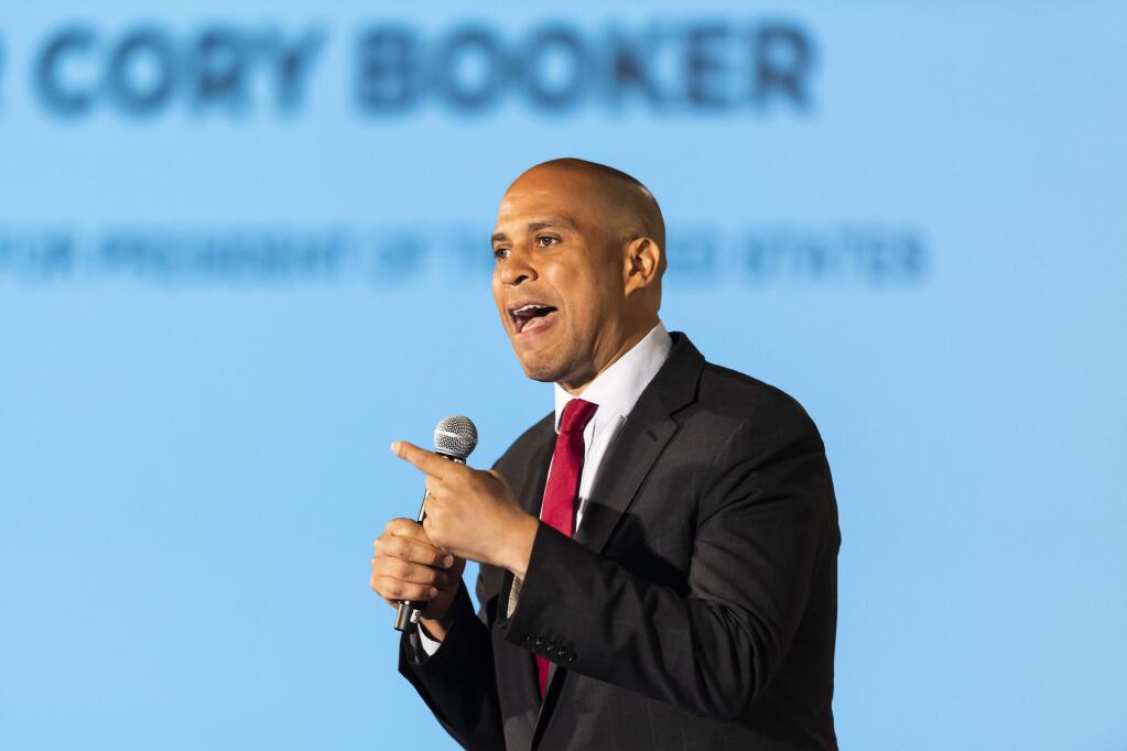 FILE - In this June 6, 2019 file photo, Democratic presidential candidate Sen. Cory Booker, of New Jersey, speaks during the African American Leadership Council Summit in Atlanta. Booker has dropped out of the presidential race after failing to qualify for the December primary debate. (AP Photo/John Amis)