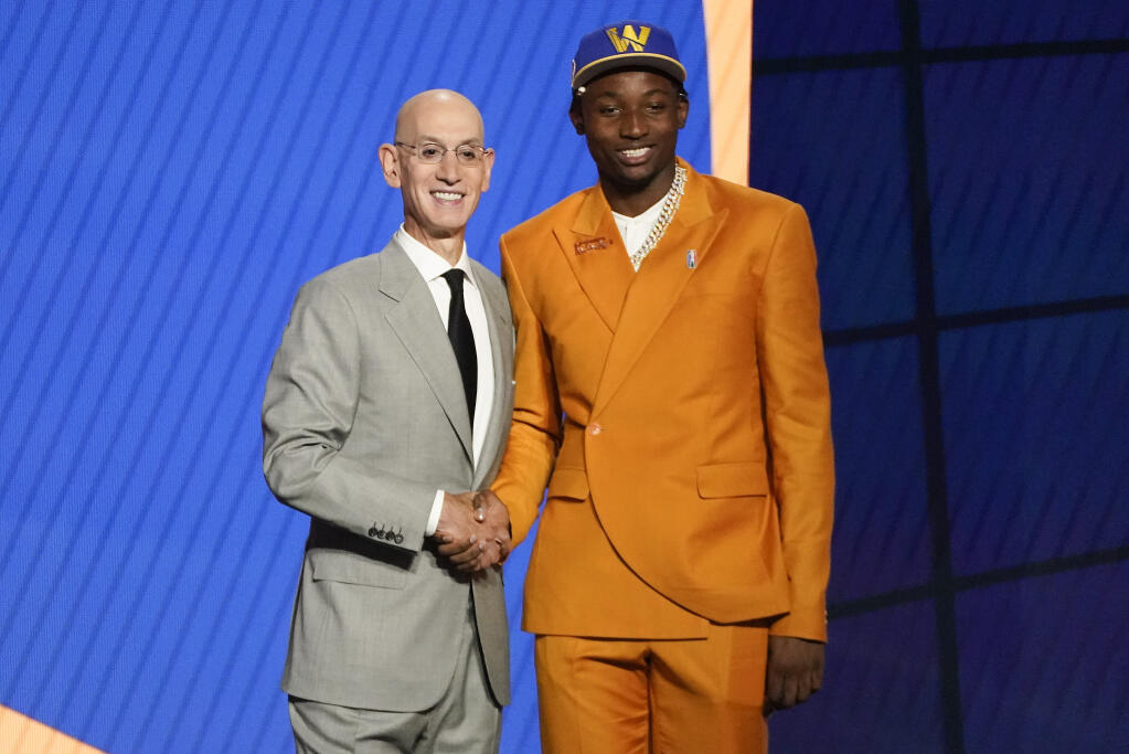 Jonathan Kuminga, right, poses for a photo with NBA Commissioner Adam Silver after being selected seventh overall by the Golden State Warriors during the NBA draft on Thursday, July 29, 2021, in New York. (Corey Sipkin / ASSOCIATED PRESS)