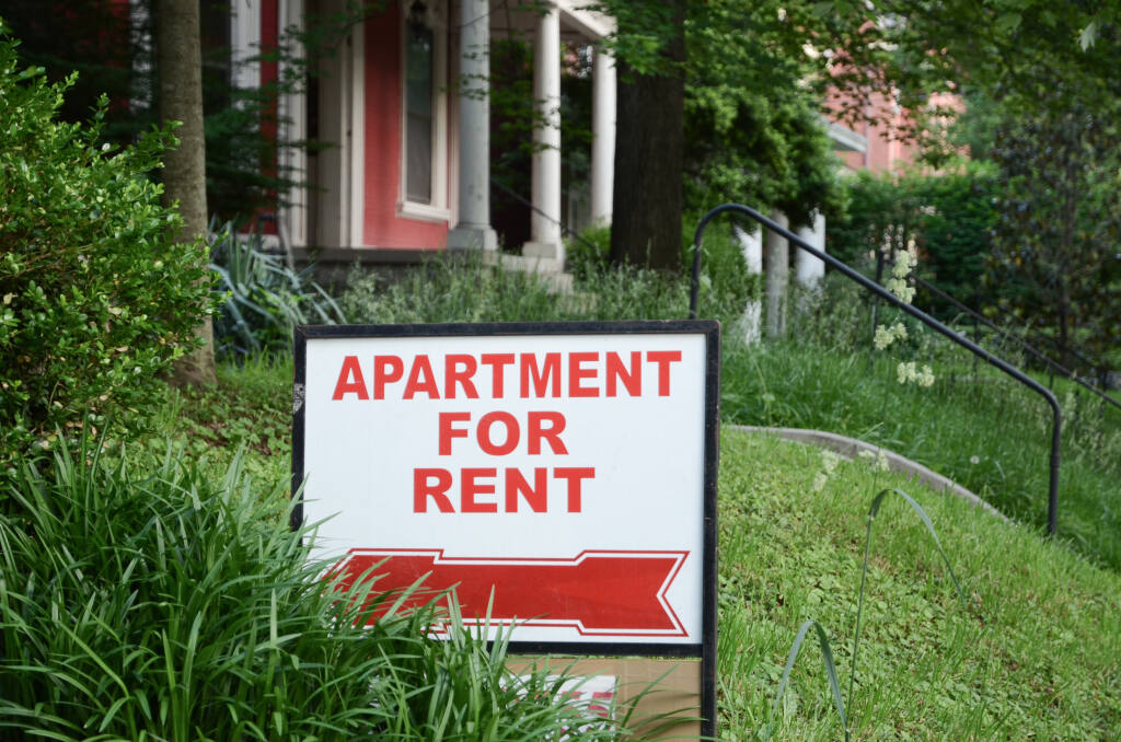Apartment for rent sign displayed on residental street. Shows demand for housing, rental market, landlord-tenant relations. North Bay counties are carrying on the program to provide pandemic funding to those who can’t pay their rents. (DC_Slim / Shutterstock)