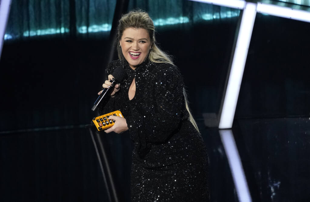 Host Kelly Clarkson speaks at the Billboard Music Awards on Wednesday, Oct. 14, 2020, at the Dolby Theatre in Los Angeles. (AP Photo/Chris Pizzello)