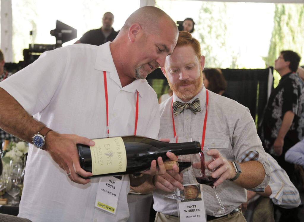Dan Kosta of Kosta Browne pours 2011 Sonoma County estate pinot noir for Matt Wheeler, chain account manager for fine wine at Southern Glazier's Wine & Spirits of Texas, at Sonoma County Barrel Auction on April 21, 2017. (FACEBOOK / SONOMAVINTNERS)