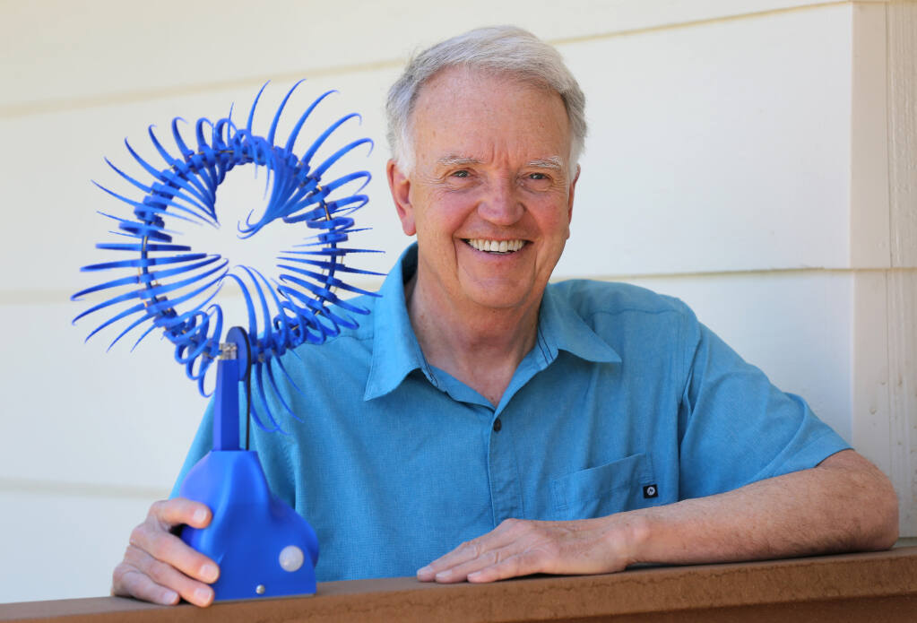 John Carlsten with a kinetic sculpture that he built using his 3D printer. Photo taken at his home in Santa Rosa, Calif. on Monday, June 13, 2022. (Beth Schlanker/The Press Democrat)