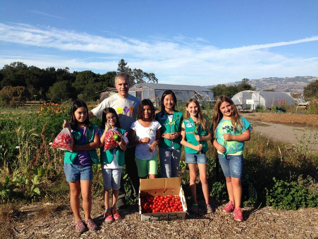JEANINE COMELLA PHOTOMeadow School Girls Scouts make a donation to the COTS' program at Petaluma Bounty