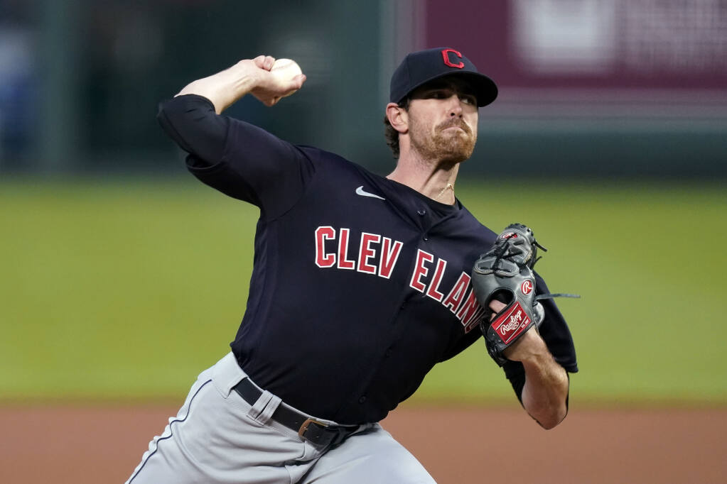 In this Aug. 31, 2020, file photo, Cleveland Indians starting pitcher Shane Bieber throws during the first inning against the Kansas City Royals in Kansas City, Missouri. Bieber won the AL Cy Young Award on Wednesday night, Nov. 11, 2020. (Charlie Riedel / ASSOCIATED PRESS)