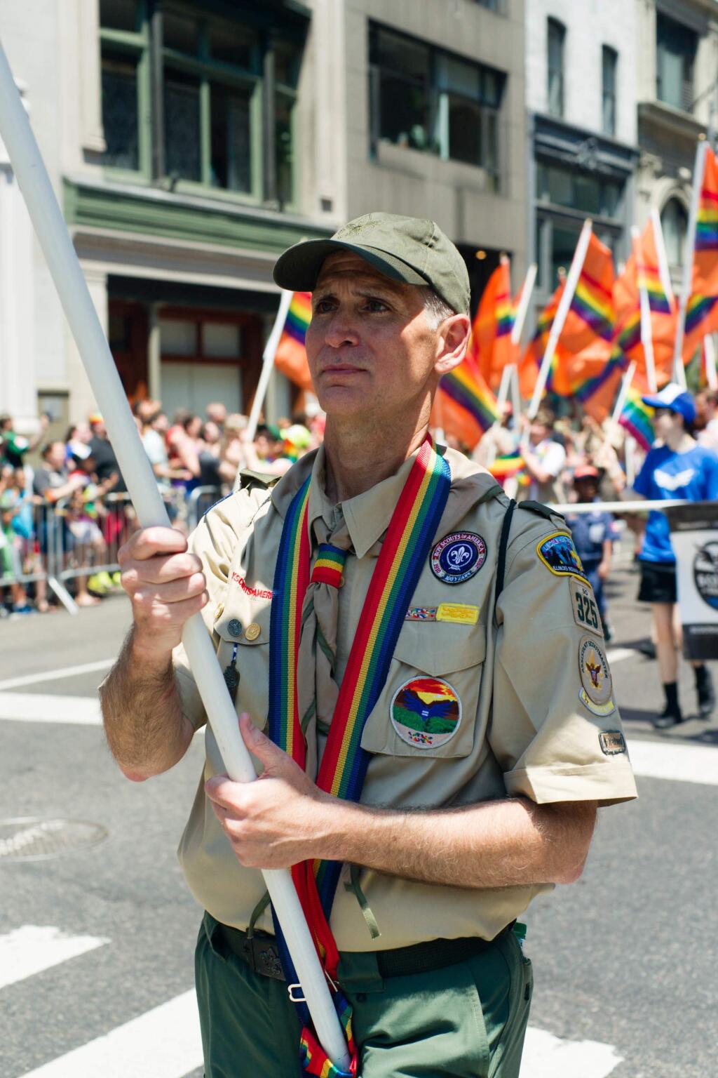 This Sunday, June 26, 2016 photo provided by Brian Gorman shows Greg Bourke from Louisville, Ky., marching in the gay pride parade in New York. Bourke went public with details of how the Archdiocese of Louisville refused to reinstate him as a leader of a Catholic-sponsored Scout troop despite the Boy Scouts of America National Executive Board's decision to end a long-standing blanket ban on participation by openly gay adults. (Brian Gorman via AP)