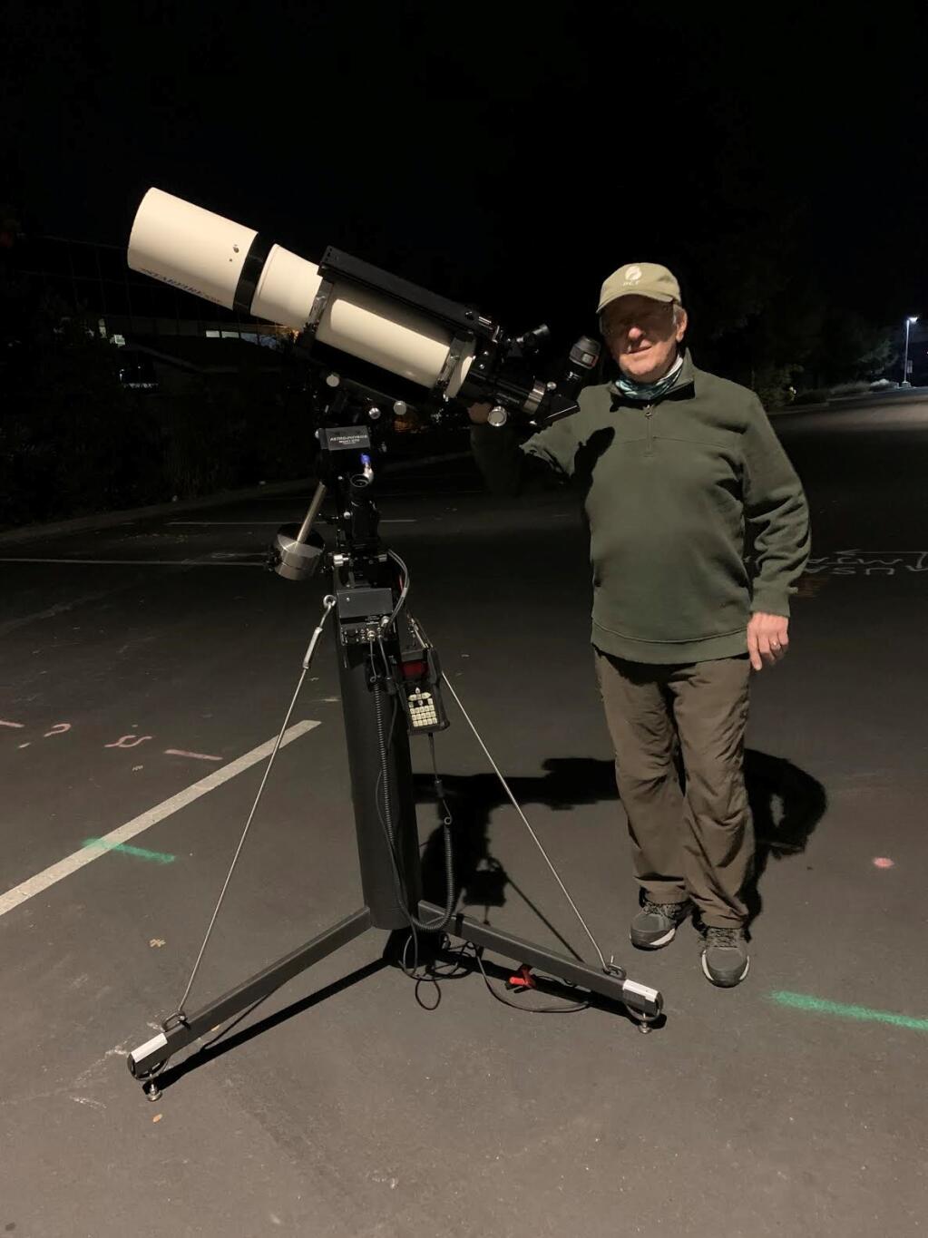 Len Nelson with his 133 mm refractor telescope, taken by Nelson on a recent evening.