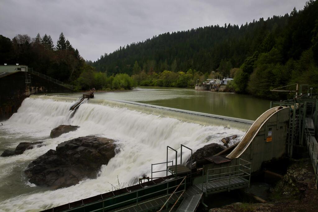Water from the Eel River collects at the Van Arsdale Reservoir and flows over the Cape Horn Dam. A percentage of the water is redirected through a diversion tunnel, at the building in the background, to the Potter Valley Powerhouse and the east fork of the Russian River. (CHRISTOPHER CHUNG / The Press Democrat)