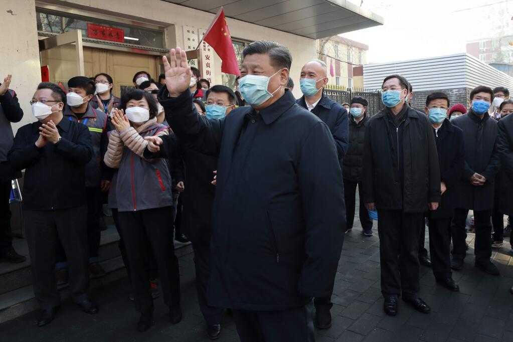 Chinese President Xi Jinping wearing a protective mask while touring a coronavirus control and prevention program in Beijing. (Xinhua)