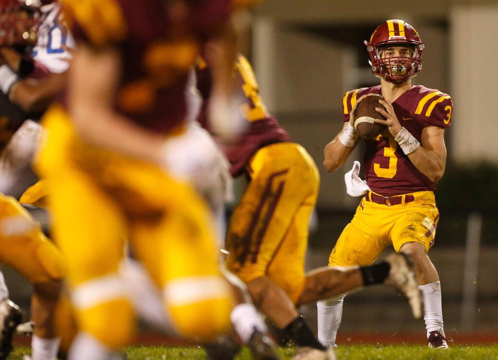 Cardinal Newman quarterback Jackson Pavitt looks to throw during the first half of the NCS Division 3 playoff football game between Encinal and Cardinal Newman high schools on Saturday, Nov. 24, 2018. (Alvin Jornada / The Press Democrat)