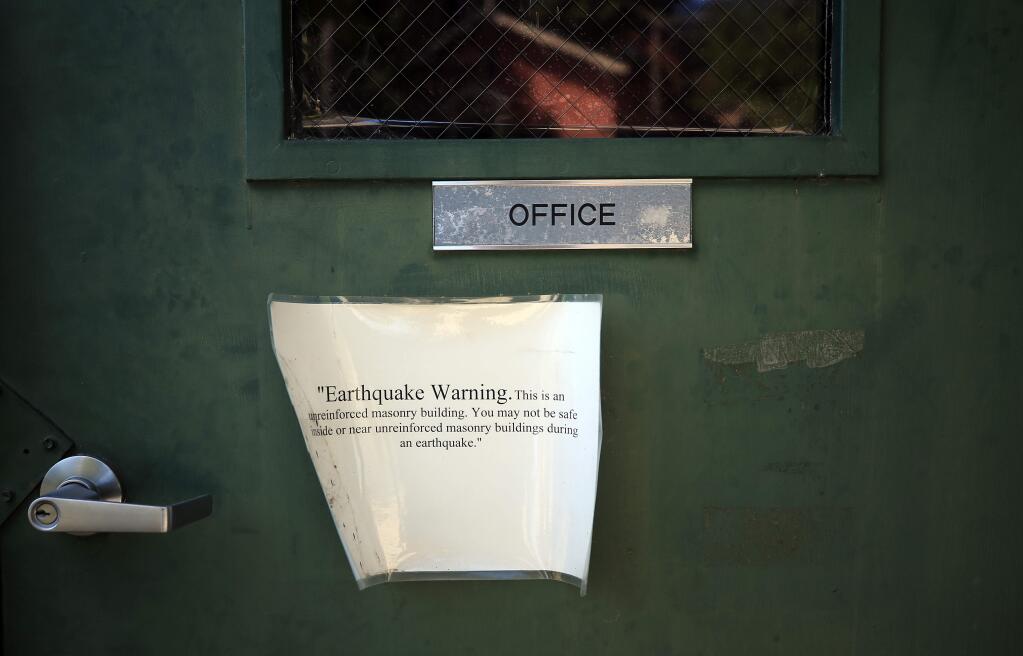 An earthquake warning placed on the office entrance of the the Russian River Fire District firehouse in Guerneville, Friday, August 23, 2019. (Kent Porter / The Press Democrat) 2019