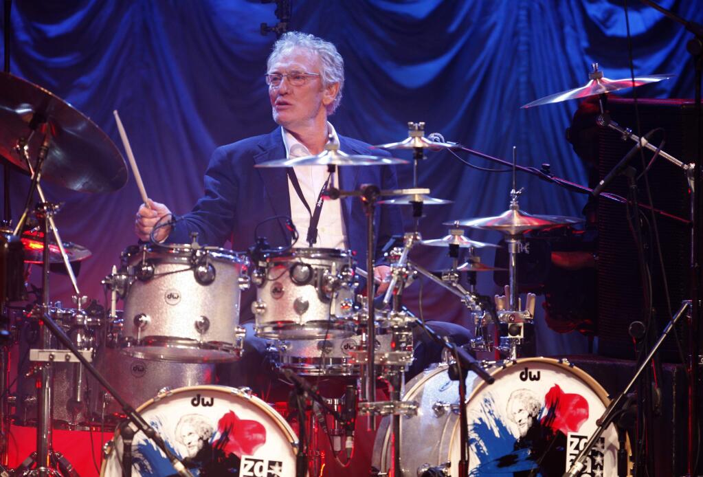 FILE - In this Sunday, Dec. 7, 2008 file photo, British musician Ginger Baker performs at the 'Zildjian Drummers Achievement Awards' at the Shepherd's Bush Empire in London. The family of drummer Ginger Baker, the volatile and propulsive British musician who was best known for his time with the power trio Cream, says he died, Sunday Oct. 6, 2019. He was 80. (AP Photo/MJ Kim, File)