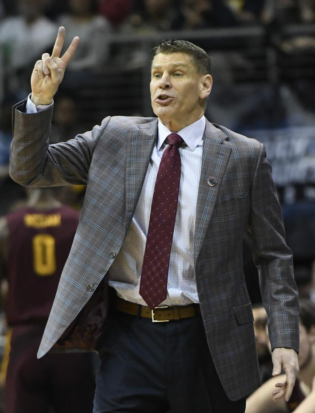 Loyola-Chicago head coach Porter Moser speaks to players during the first half of a regional final NCAA college basketball tournament game between Loyola-Chicago and Kansas State, Saturday, March 24, 2018, in Atlanta. (AP Photo/John Amis)