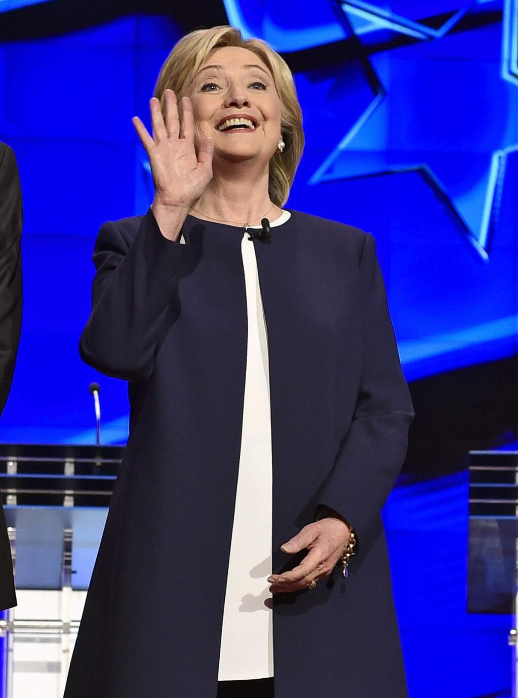 Democratic presidential candidate Hillary Rodham Clinton waves as she takes the stage before the CNN Democratic presidential debate Tuesday, Oct. 13, 2015, in Las Vegas. (AP Photo/David Becker)