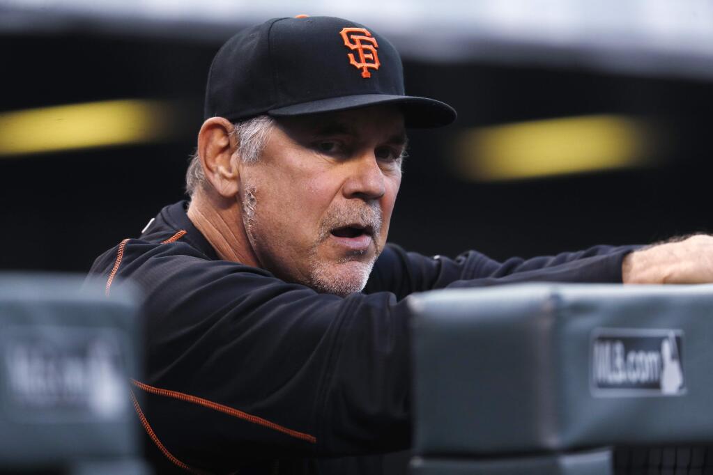 San Francisco Giants manager Bruce Bochy looks on against the Colorado Rockies in the first inning Tuesday, Sept. 5, 2017, in Denver. (AP Photo/David Zalubowski)