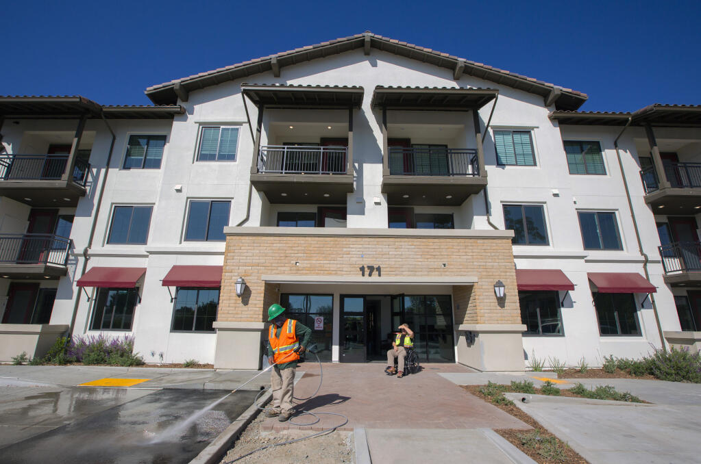 Workers put the finishing touches in a common area of the three-story, 92-unit Siesta Senior Apartments on Highway 12 in Boyes Hot Springs in preparation for the grand opening. Photo taken on Wednesday, Oct. 18, 2023. (Robbi Pengelly/Index-Tribune)