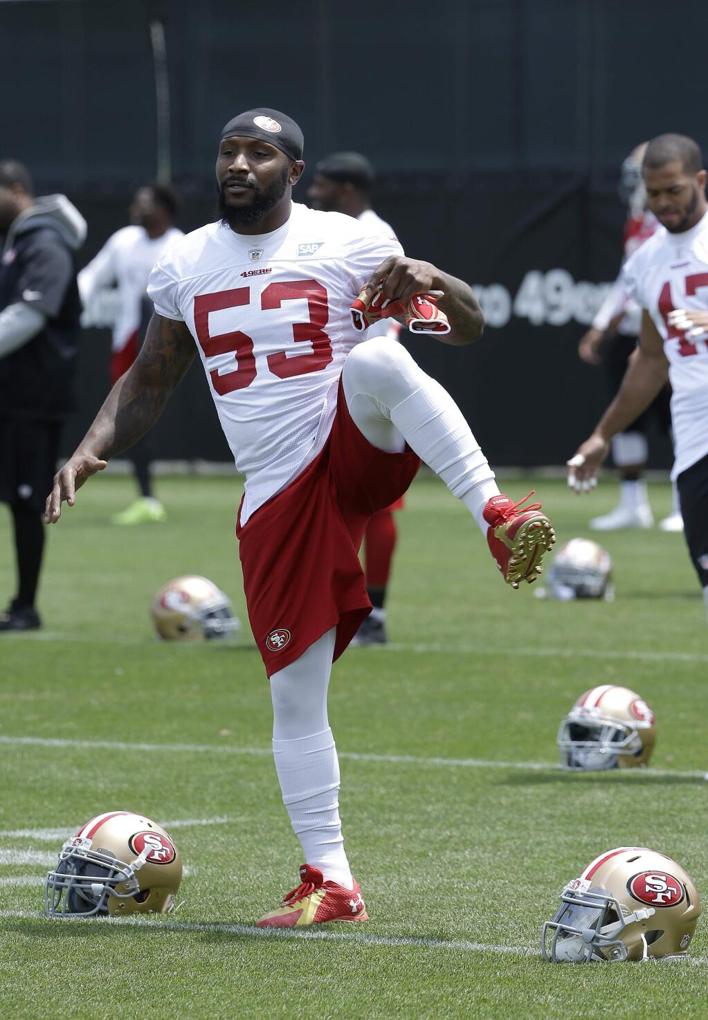 San Francisco 49ers linebacker NaVorro Bowman (53) stretches during practice in Santa Clara, Friday, May 29, 2015. (AP Photo/Jeff Chiu)