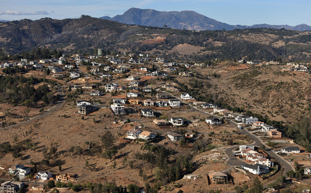 Fountaingrove’s Crown Hill neighborhood, foreground, was in the direct path of the 2017 Tubbs Fire that ignited close to the base of Mt. St. Helena, background. The area was once heavily forested, including Foothill Ranch above Riebi and Rincon Valley background middle. (Kent Porter/The Press Democrat)