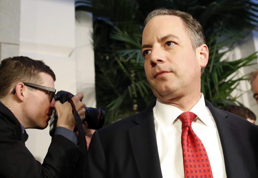 FILE - In a March 23, 2017 file photo, White House Chief of Staff Reince Priebus, right, departs after a Republican caucus meeting on Capitol Hill, in Washington. Speaking on 'Fox News Sunday,' March 26, 2017, Priebus made clear that President Donald Trump would be seeking support from moderate Democrats for upcoming legislative battles. (AP Photo/Alex Brandon, File)