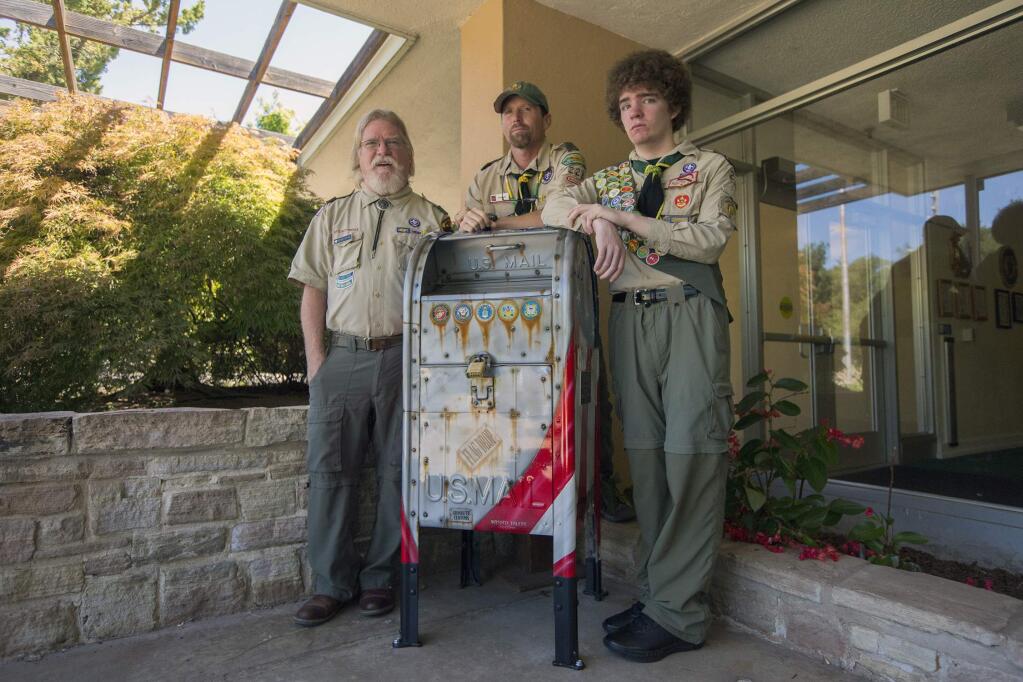 From left, Richard Steyart, Bryan Aubin and Roland Steyart , 17, gathered around the new flag-drop box at the Sonoma Veterans Memorial Building on Wednesday, July 11. The box was Roland's Eagle Scout project. Anyone who has a flag that is damaged or that they no longer use, can drop it off at the box. The flags will then be properly disposed of with dignity. (Photo by Robbi Pengelly/Index-Tribune)
