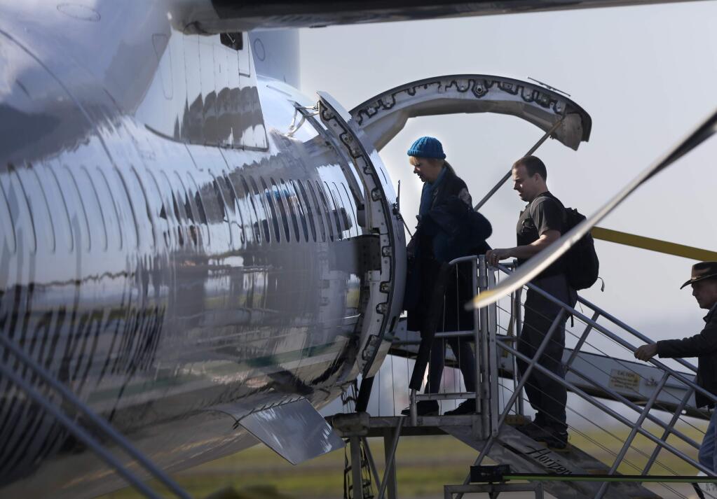 Passengers board an Alaska Airlines flight to Portland at the Sonoma County Airport on Thursday, Jan. 22, 2015. (BETH SCHLANKER / The Press Democrat)